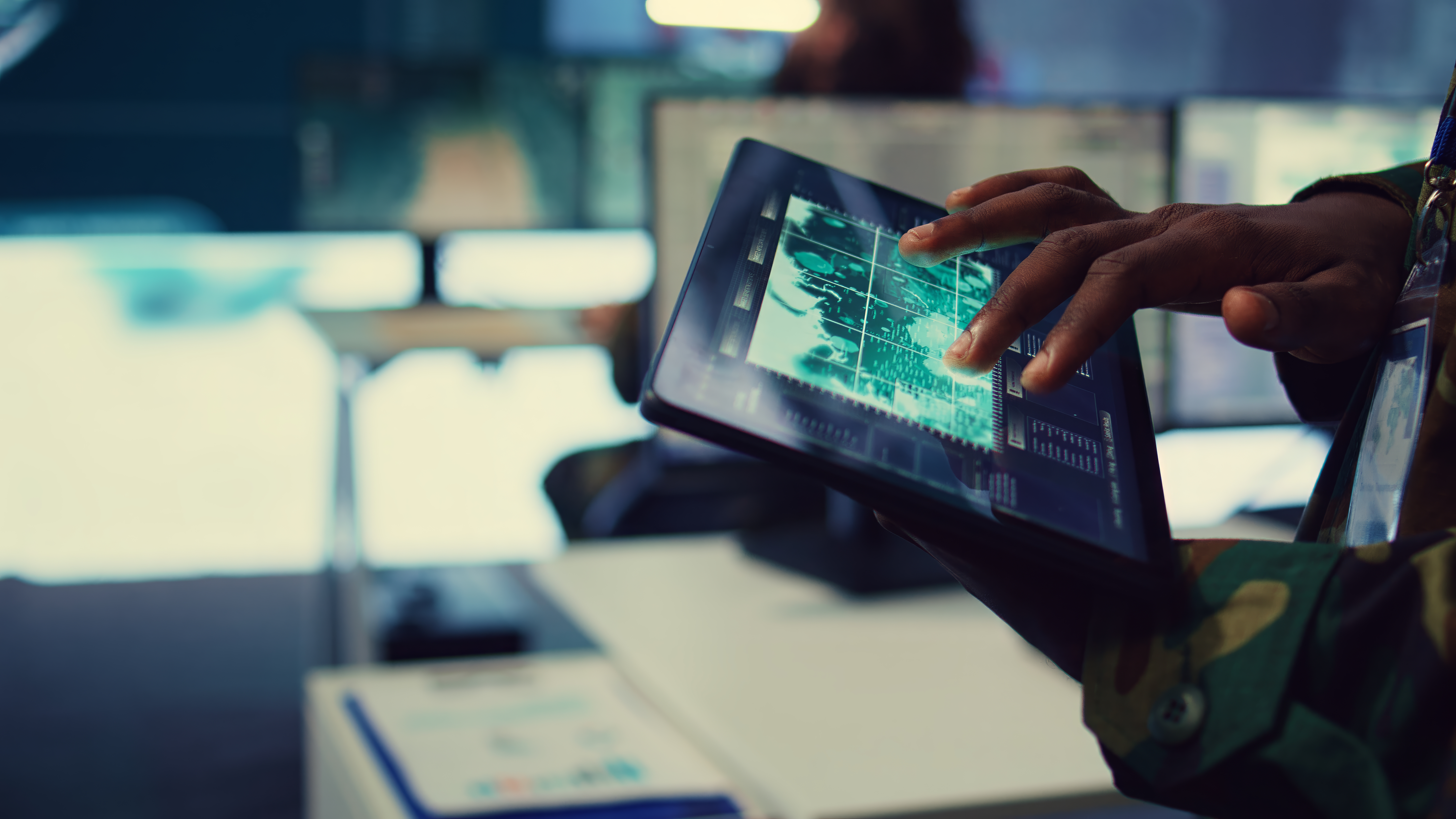 military-it-professional-gathers-intelligence-from-world-map-projection (1).jpg